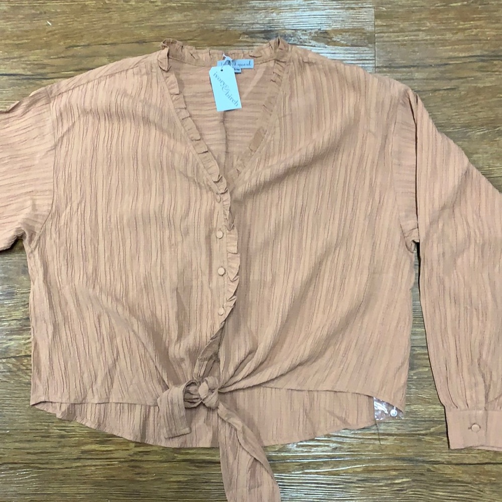 Rust colored the blouse with tie